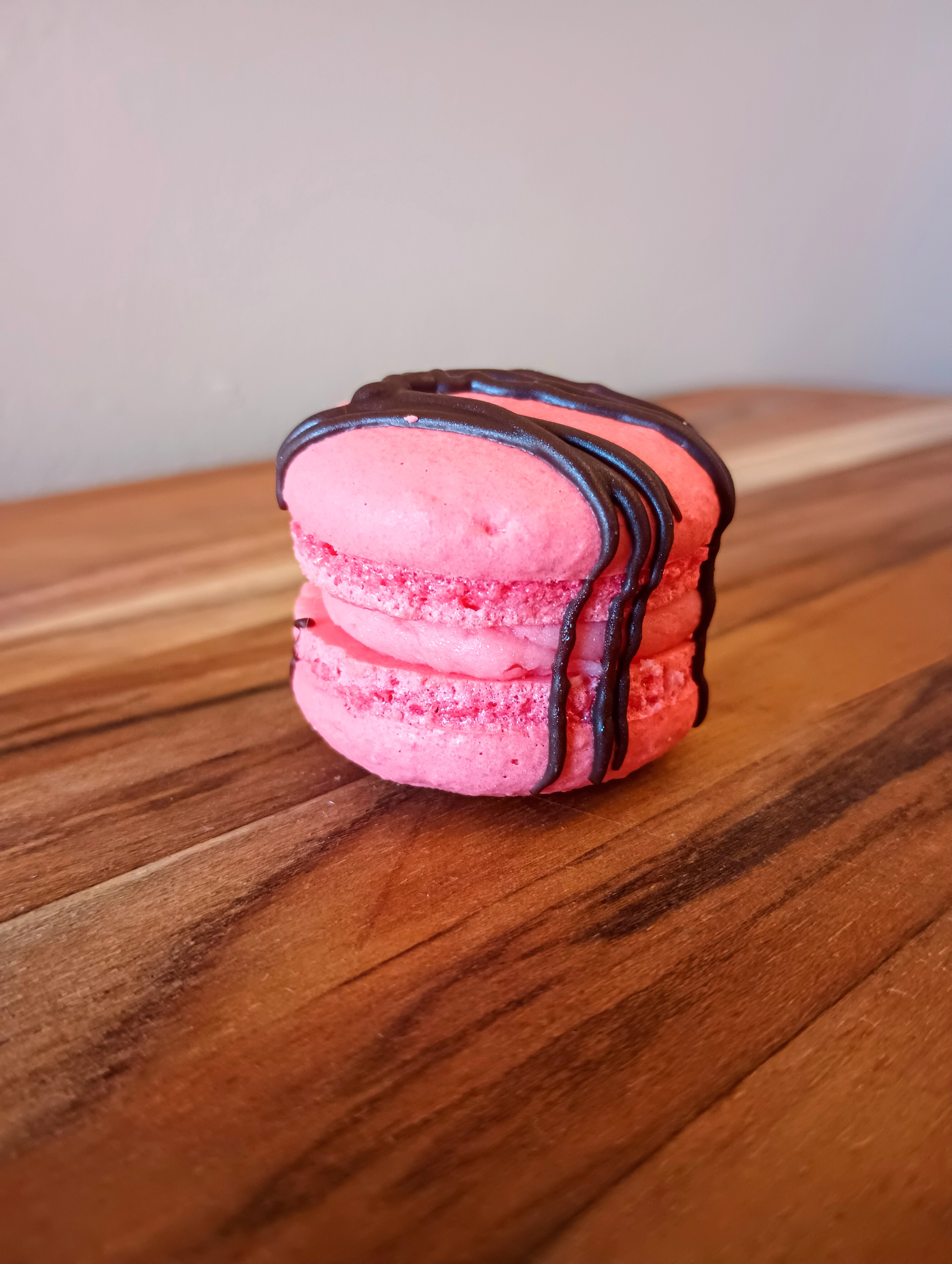 A red strawberry macaron